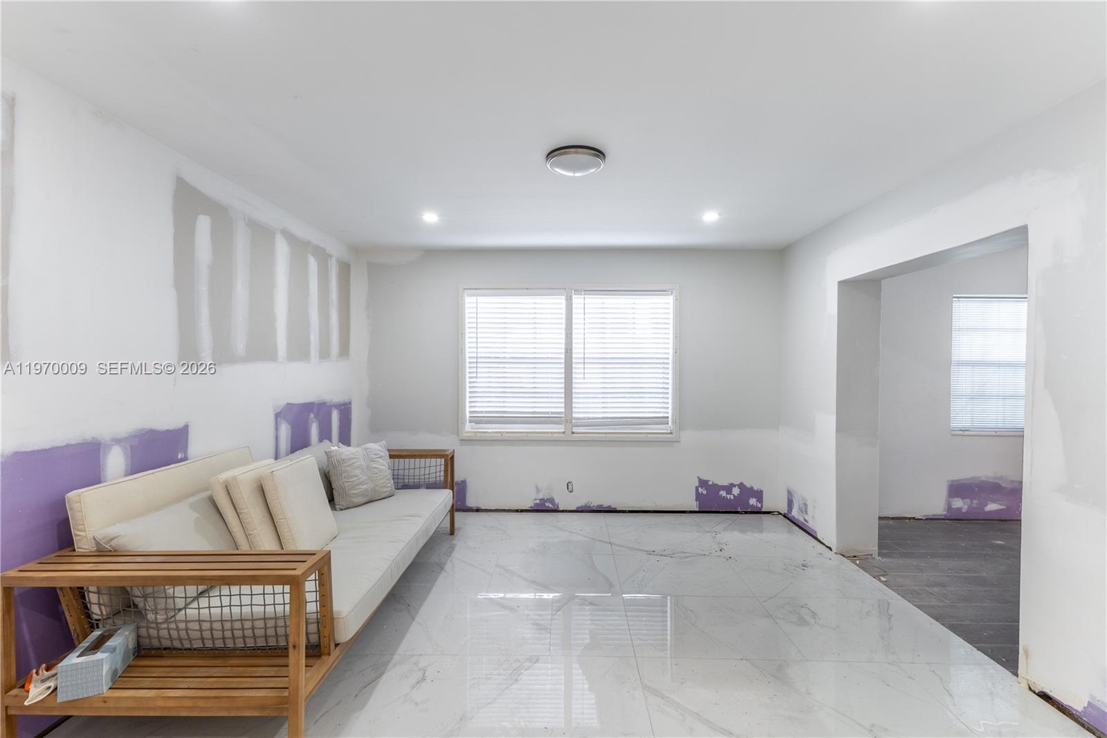 4555 Alton Road Miami Beach, FL 33140 - Photo 13 of 34 a living room with furniture and a window