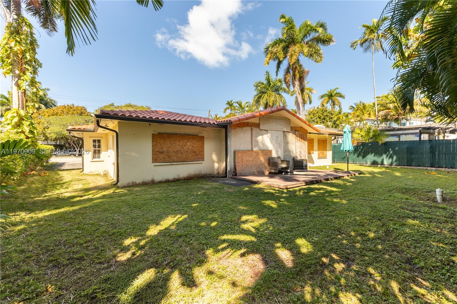 4555 Alton Road Miami Beach, FL 33140 - Photo 21 of 34 a house view with swimming pool in front of it