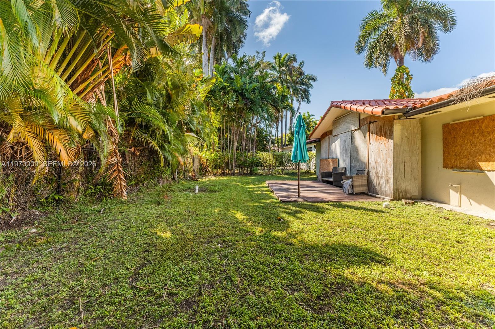 4555 Alton Road Miami Beach, FL 33140 - Photo 24 of 34 a view of a yard with a house