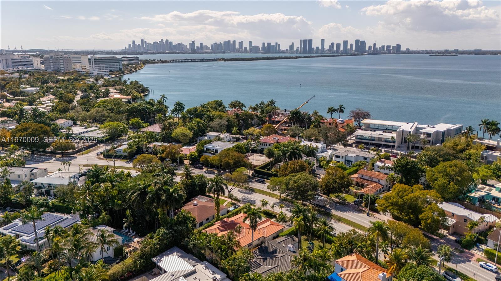 4555 Alton Road Miami Beach, FL 33140 - Photo 26 of 34 a view of a lake with a city