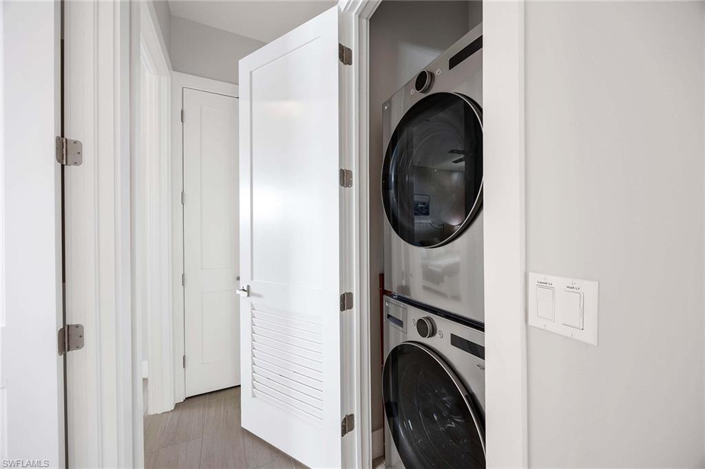 1395 Curlew Avenue, Unit 43 Naples, FL 34102 - Photo 17 of 24 a view of a hallway with washer and dryer