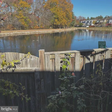a view of a lake with a bench next to a lake