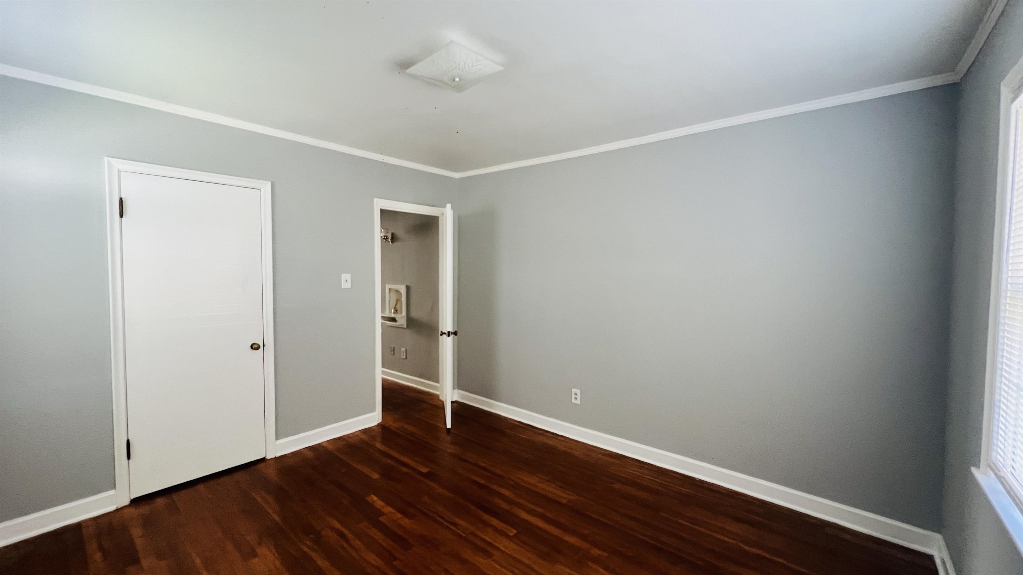 3579 Powell Avenue Memphis, TN 38122 - Photo 11 of 18 a view of an empty room with wooden floor