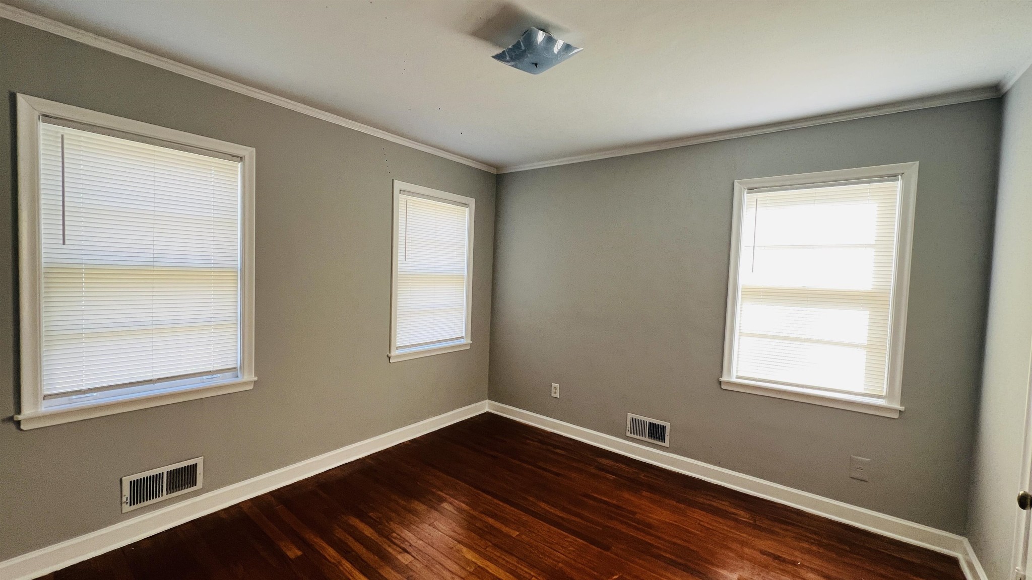 3579 Powell Avenue Memphis, TN 38122 - Photo 13 of 18 a room with a window and wooden floor