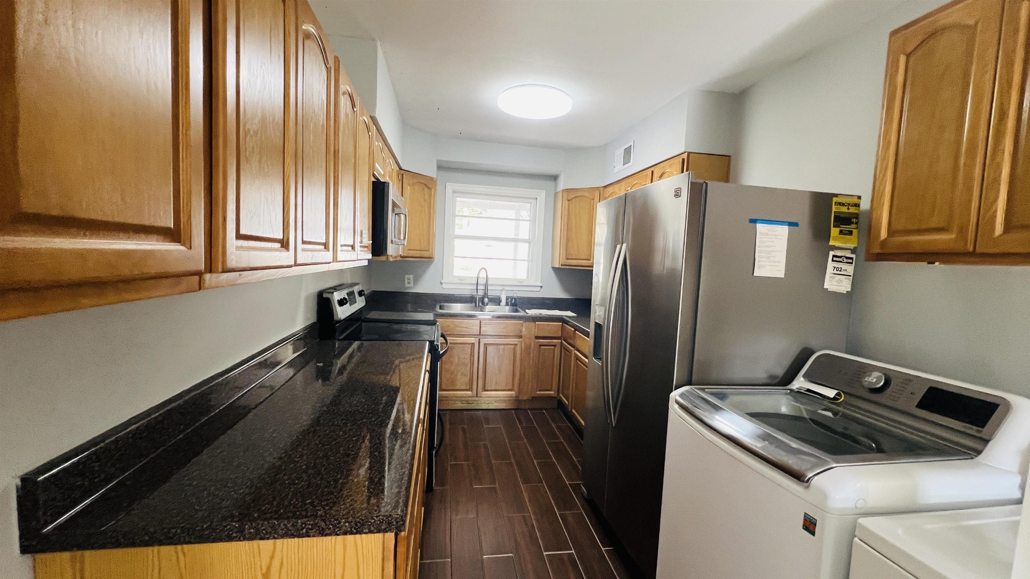 3579 Powell Avenue Memphis, TN 38122 - Photo 14 of 18 a kitchen with a refrigerator and a sink