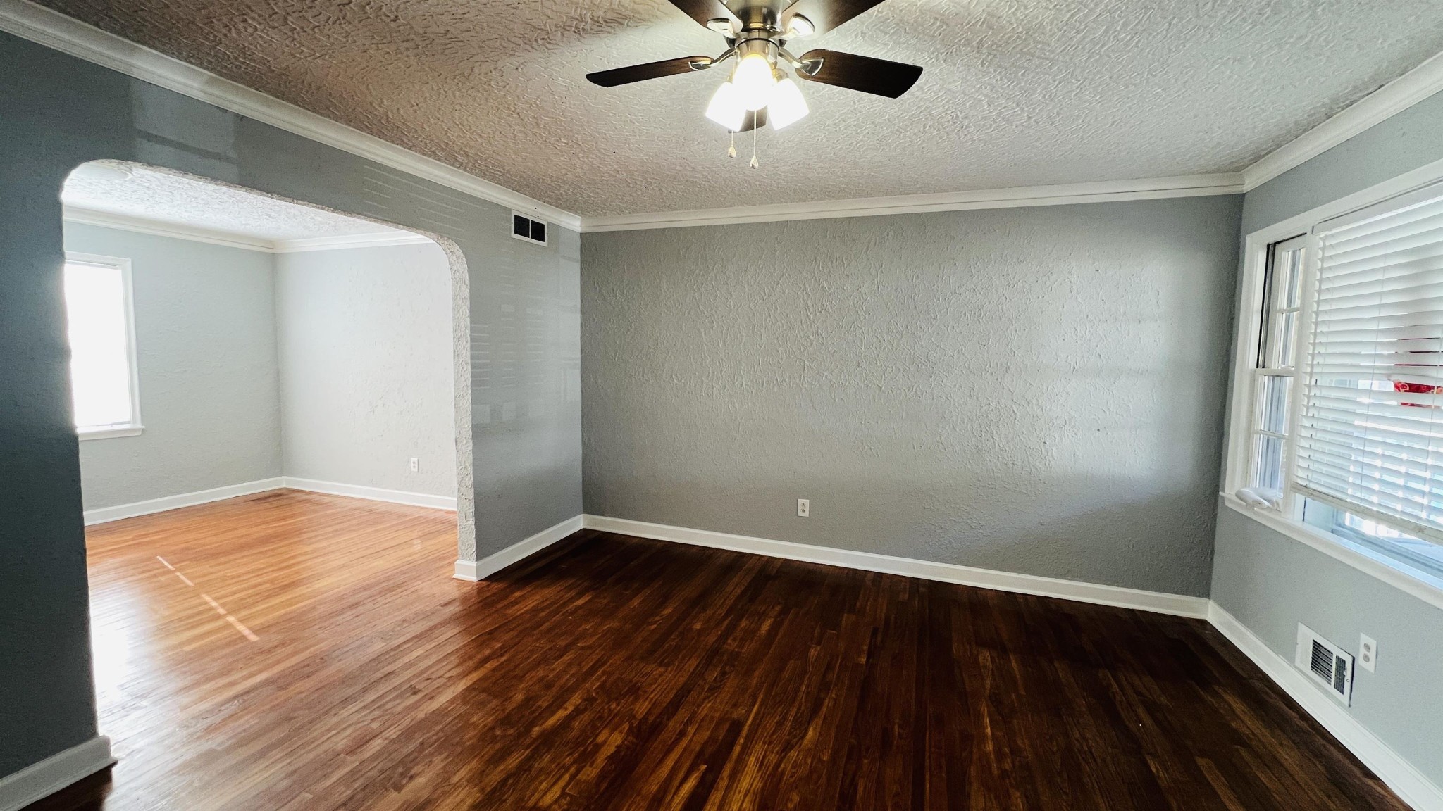 3579 Powell Avenue Memphis, TN 38122 - Photo 17 of 18 a view of an empty room with wooden floor and a window