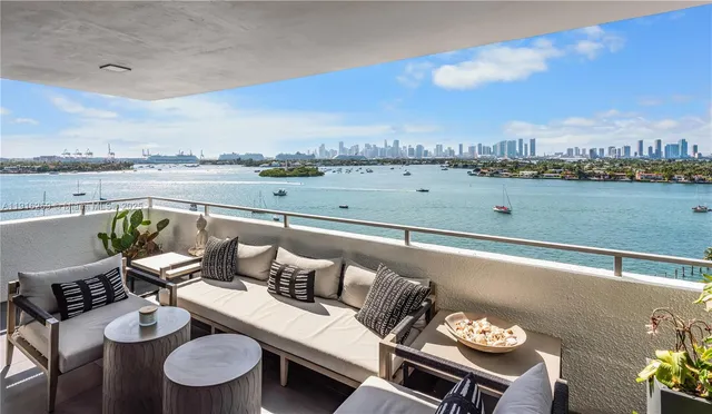 a terrace with outdoor seating and city view