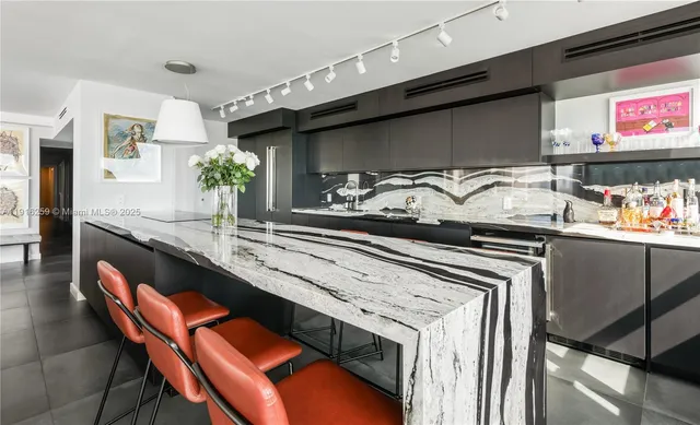 a kitchen with a table and chairs