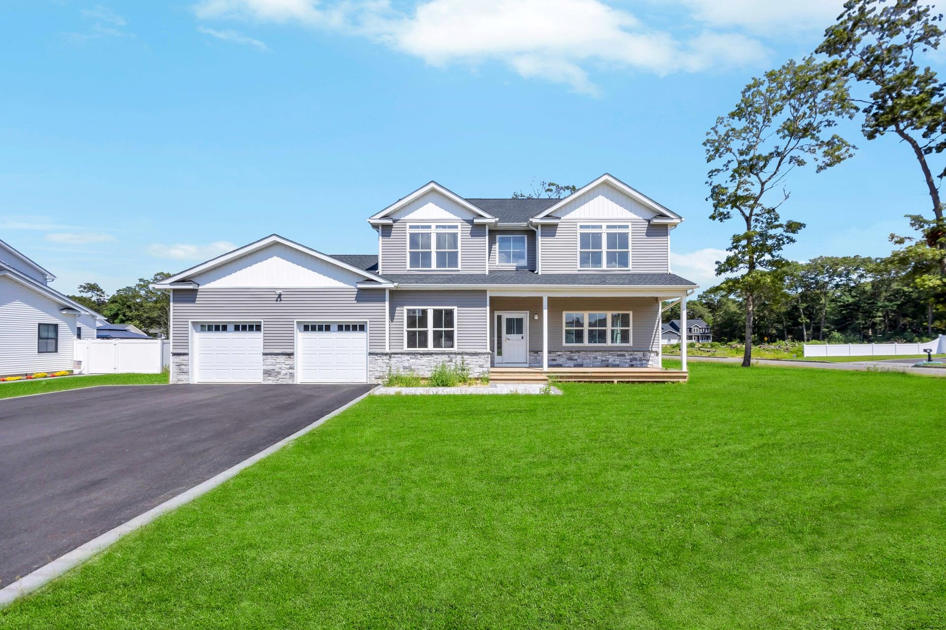 Lot #3 Cardinal Court Ridge, NY 11961 - Photo 14 of 31 a front view of a house with a garden and yard