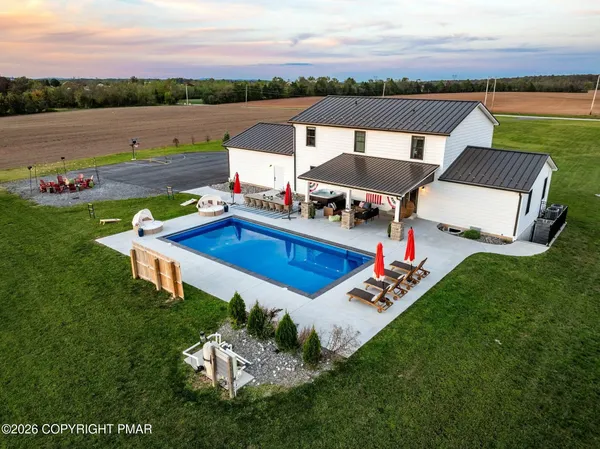 a view of swimming pool with lounge chair