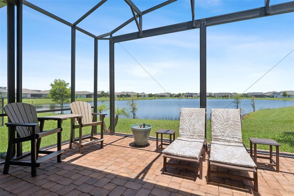 2665 Meadowedge Loop St. Cloud, FL 34772 - Photo 5 of 53 a view of a patio with chairs and table
