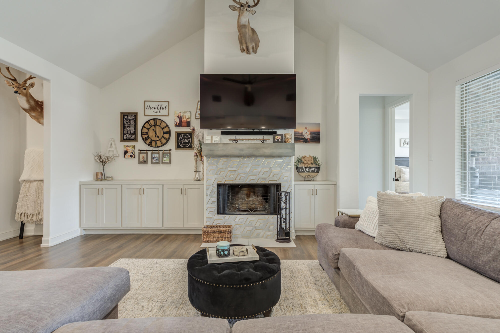 4624 139th Street Lubbock, TX 79424 - Photo 13 of 52 a living room with furniture a flat screen tv and a fireplace
