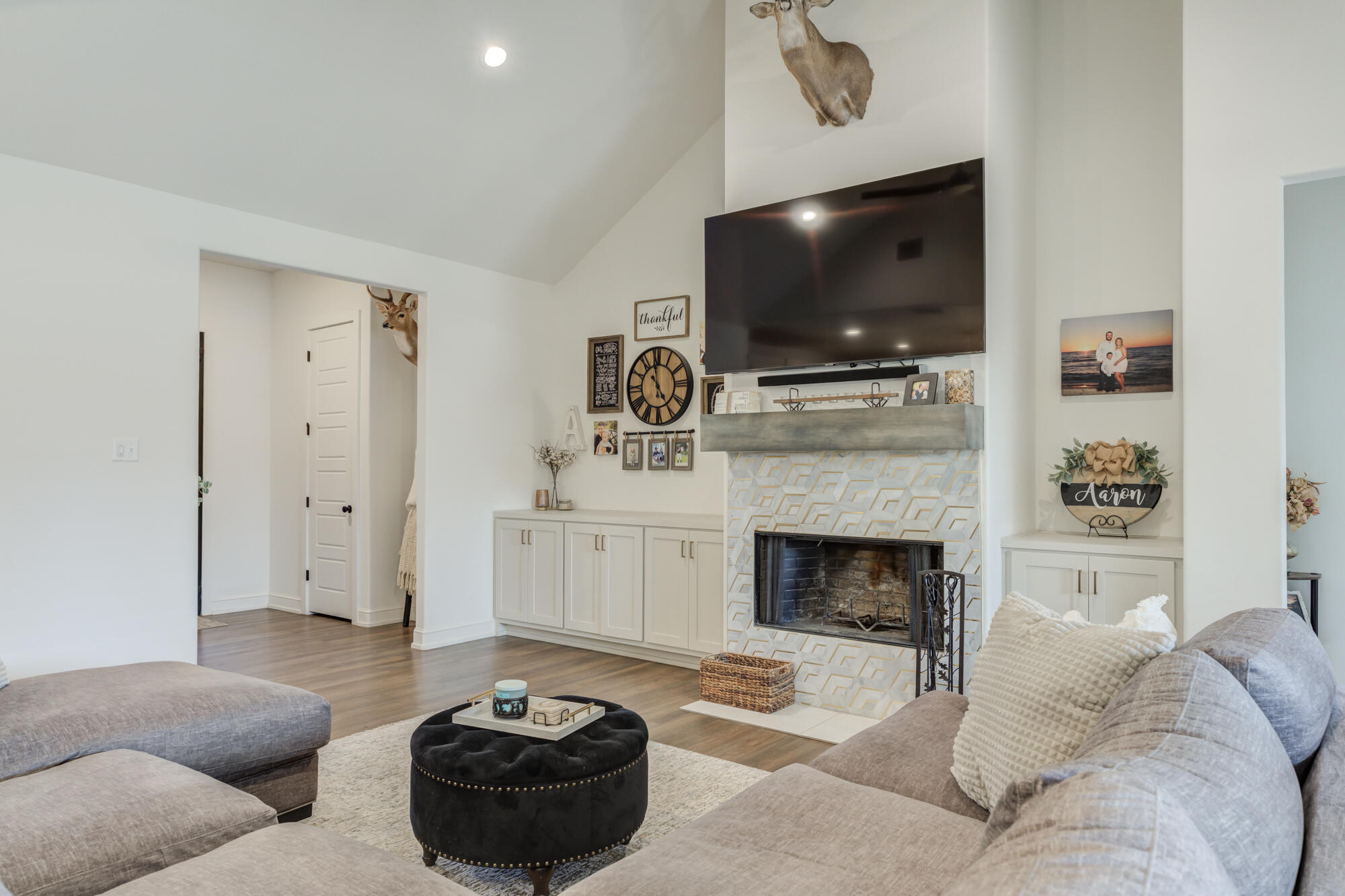 4624 139th Street Lubbock, TX 79424 - Photo 14 of 52 a living room with furniture a flat screen tv and a fireplace
