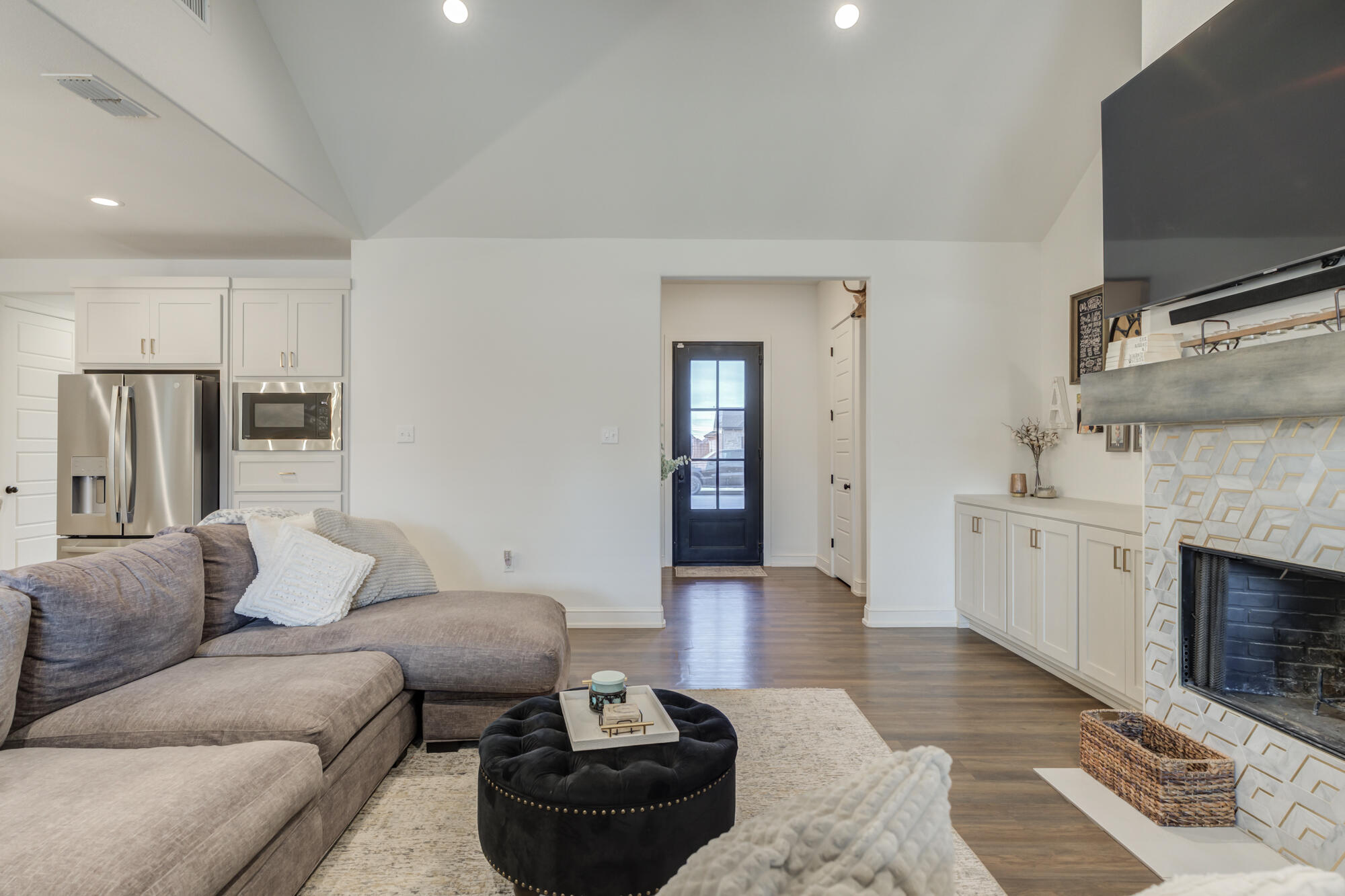 4624 139th Street Lubbock, TX 79424 - Photo 15 of 52 a living room with furniture and a fireplace