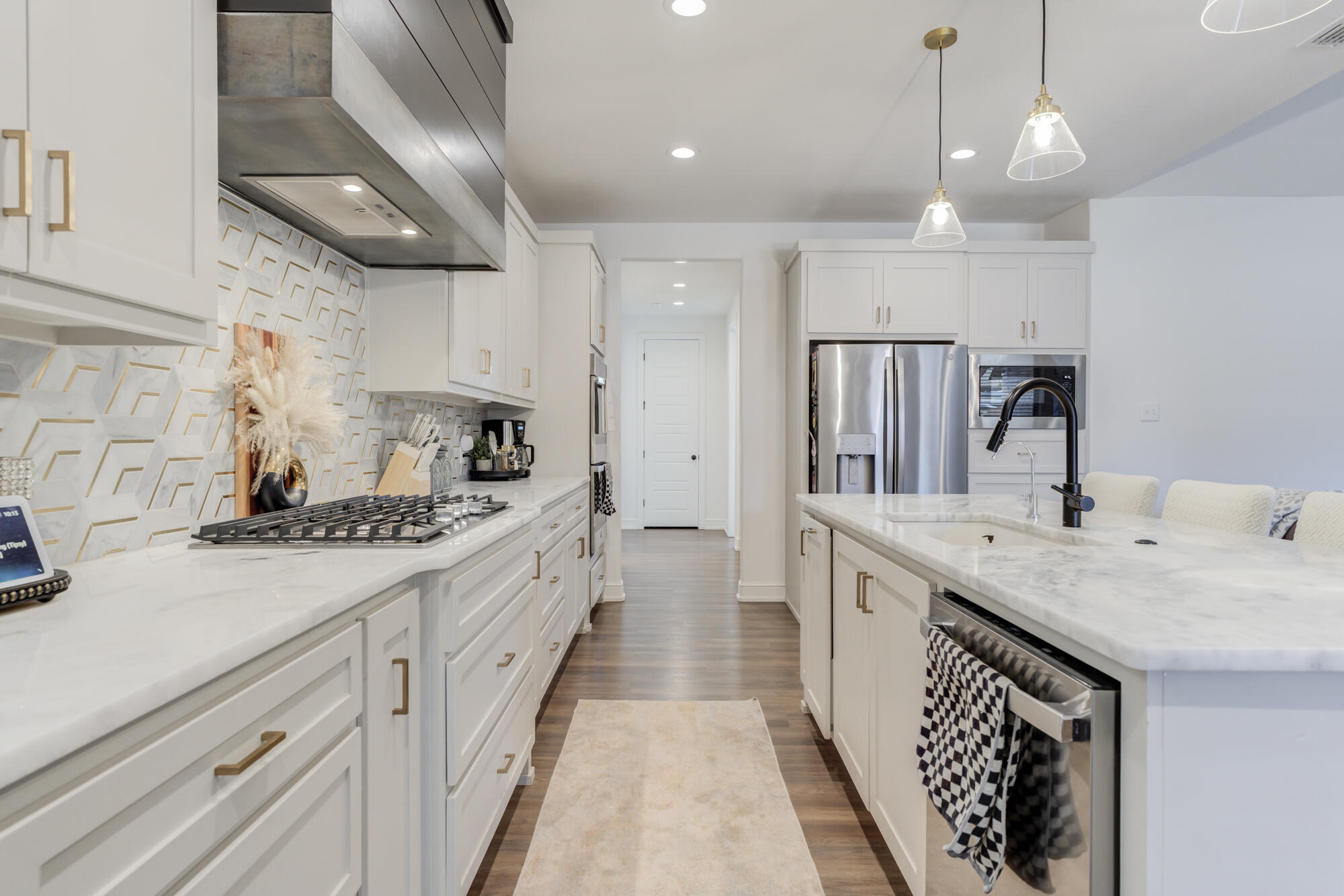 4624 139th Street Lubbock, TX 79424 - Photo 19 of 52 a large kitchen with stainless steel appliances granite countertop a sink and cabinets