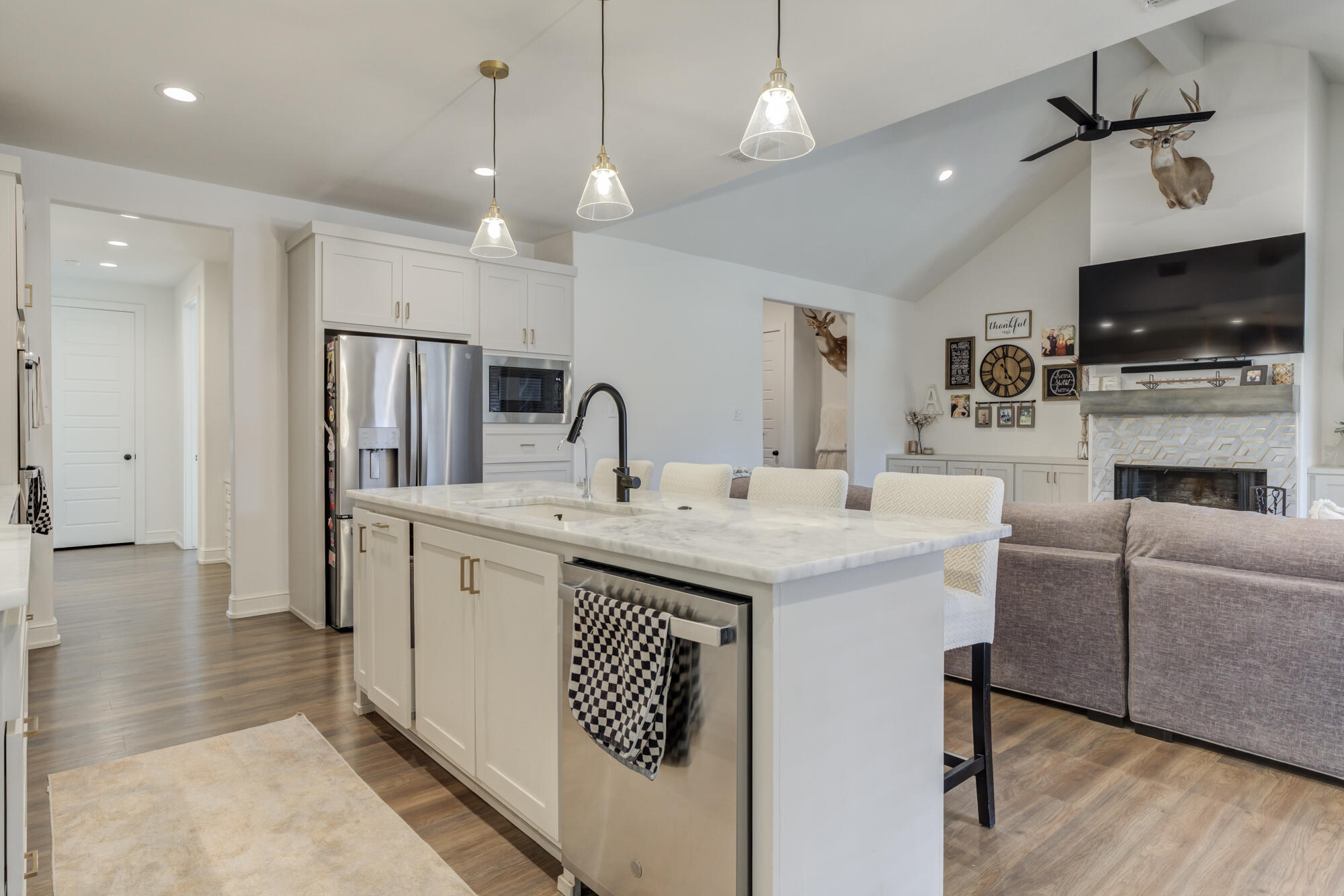 4624 139th Street Lubbock, TX 79424 - Photo 20 of 52 a kitchen with a sink stainless steel appliances and refrigerator