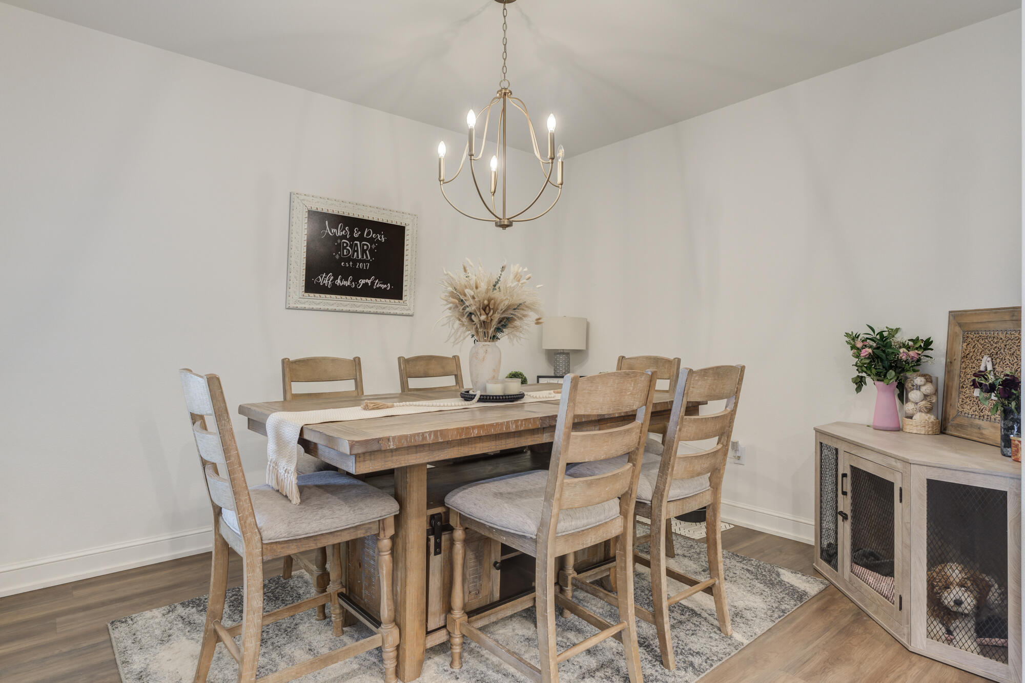 4624 139th Street Lubbock, TX 79424 - Photo 23 of 52 a view of a dining room with furniture and wooden floor