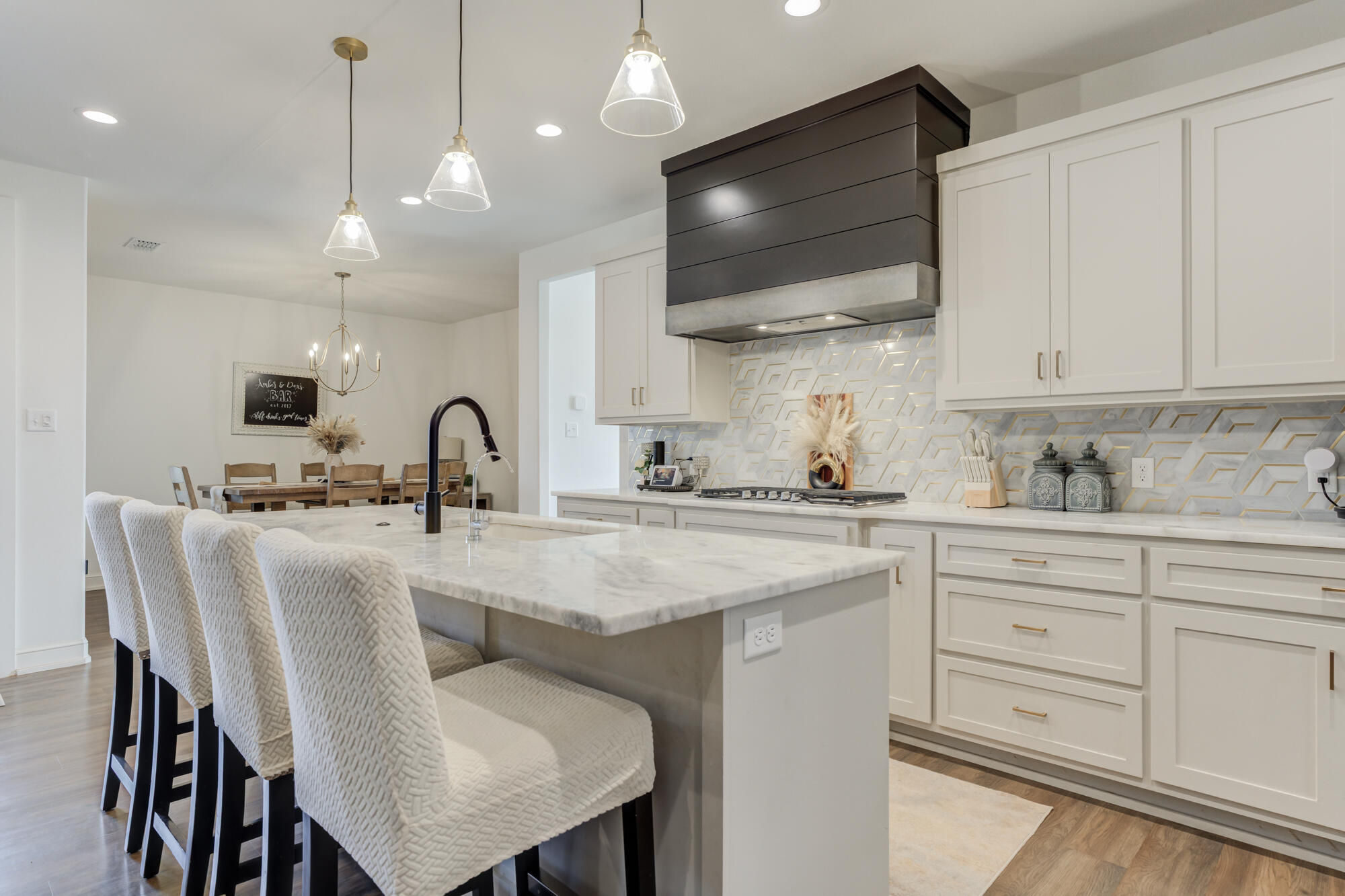 4624 139th Street Lubbock, TX 79424 - Photo 24 of 52 a kitchen with cabinets a sink and a stove