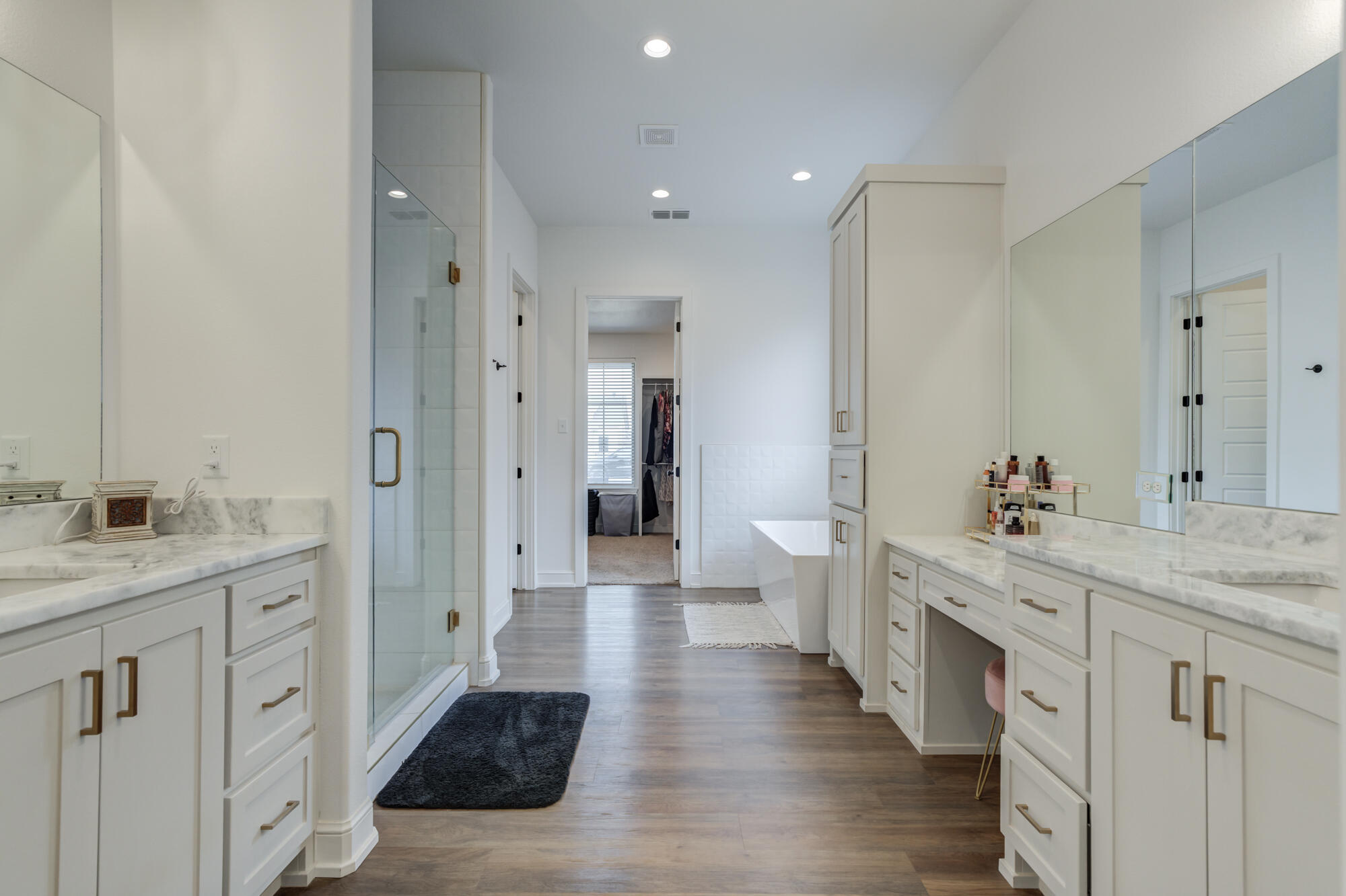 4624 139th Street Lubbock, TX 79424 - Photo 28 of 52 a spacious bathroom with a double vanity sink and a mirror