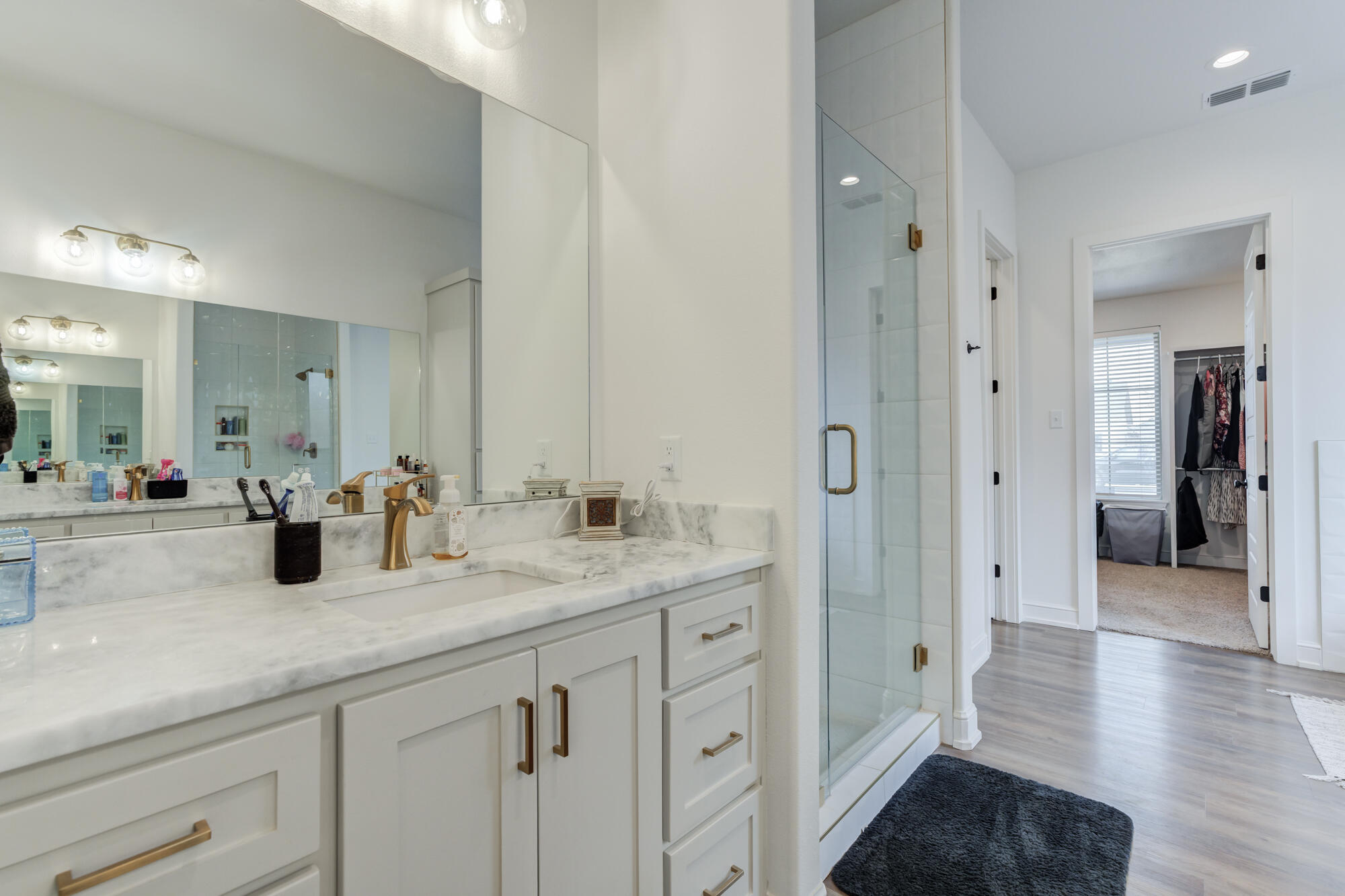 4624 139th Street Lubbock, TX 79424 - Photo 29 of 52 a bathroom with a sink and a mirror