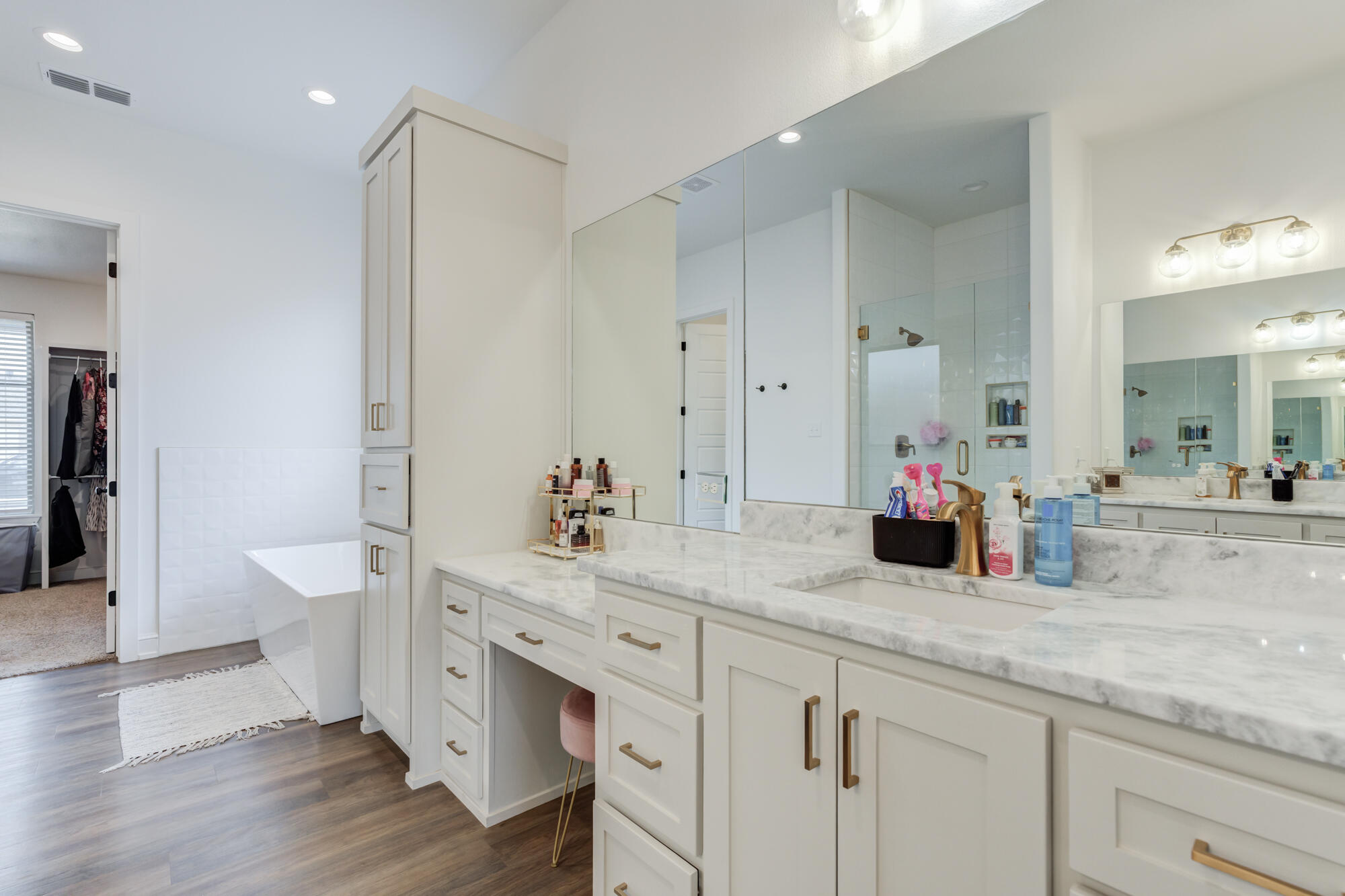 4624 139th Street Lubbock, TX 79424 - Photo 30 of 52 a spacious bathroom with a granite countertop sink a toilet a mirror and shower