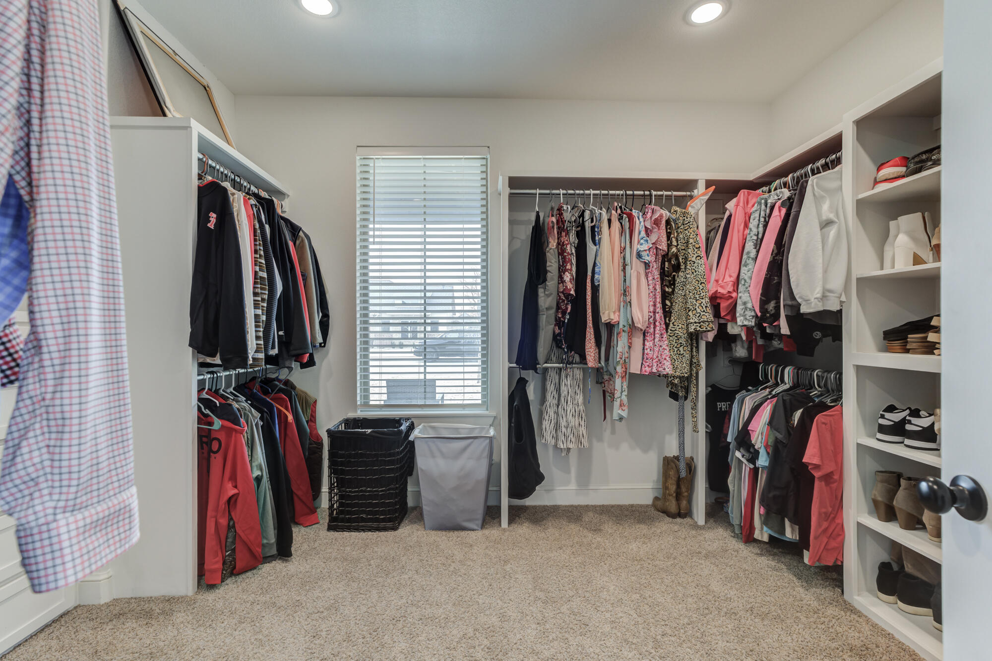4624 139th Street Lubbock, TX 79424 - Photo 33 of 52 a view of walk in closet with clothes