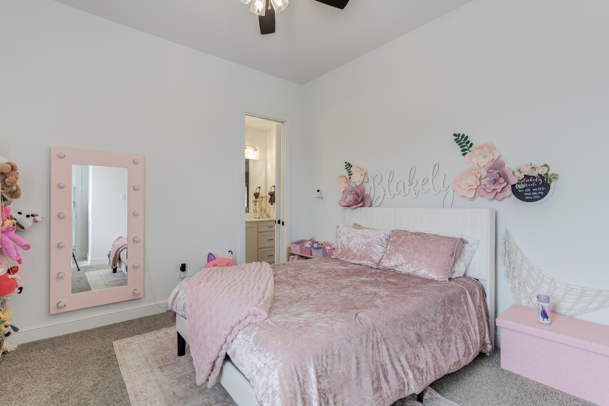 4624 139th Street Lubbock, TX 79424 - Photo 34 of 52 a bedroom with a bed and a chandelier