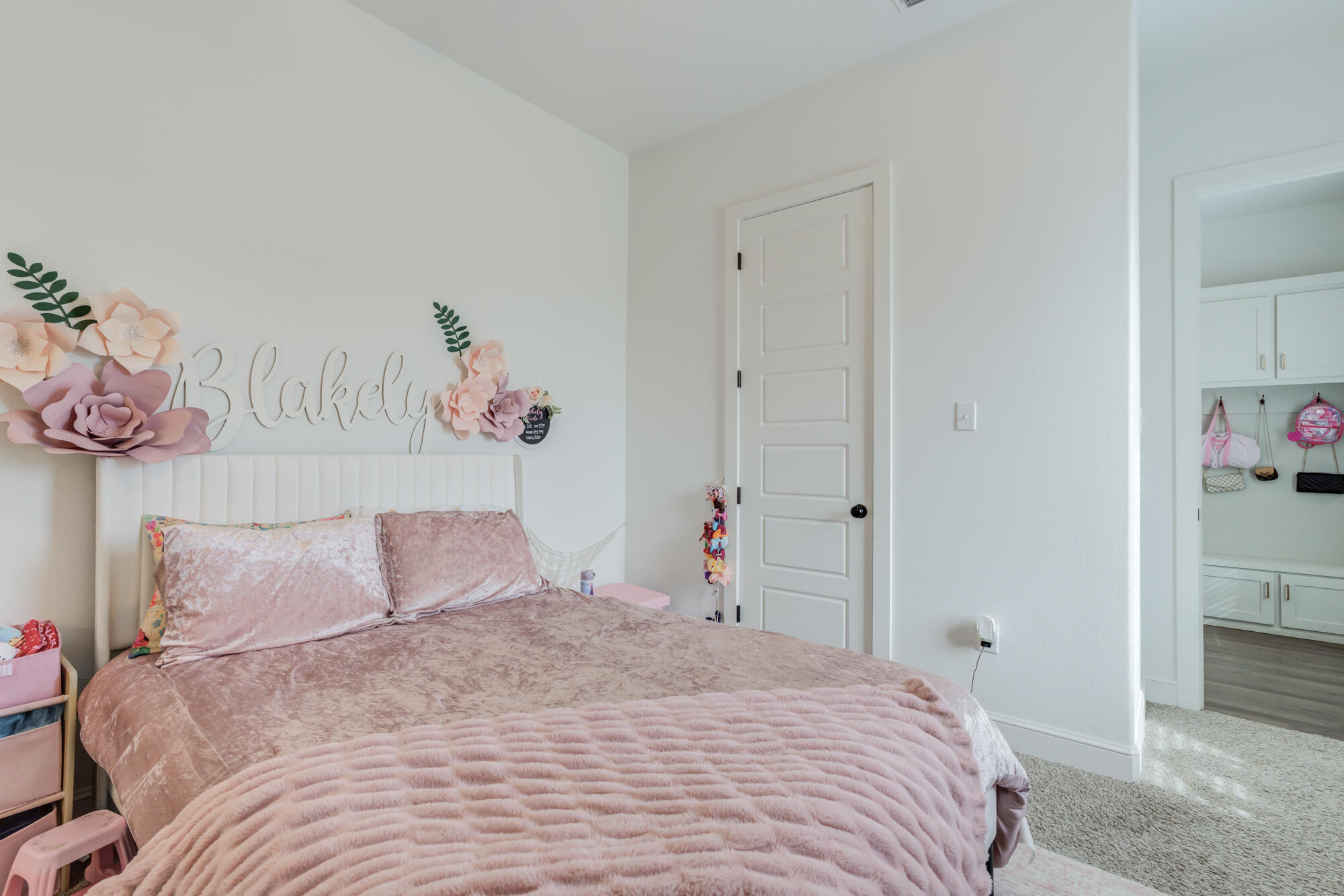 4624 139th Street Lubbock, TX 79424 - Photo 35 of 52 a bedroom with a bed and a painting on the wall