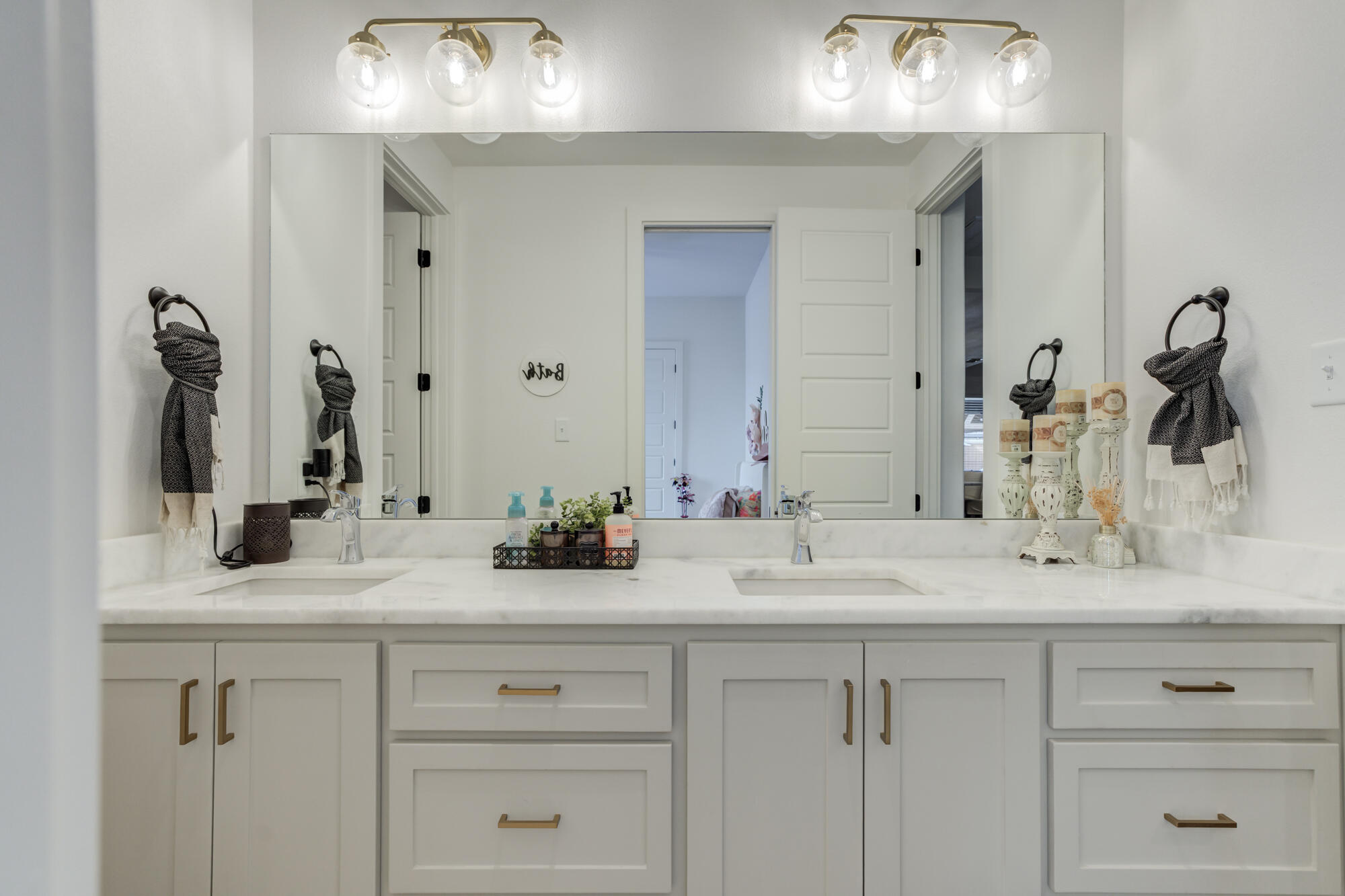 4624 139th Street Lubbock, TX 79424 - Photo 36 of 52 a bathroom with double vanity sinks and a mirror