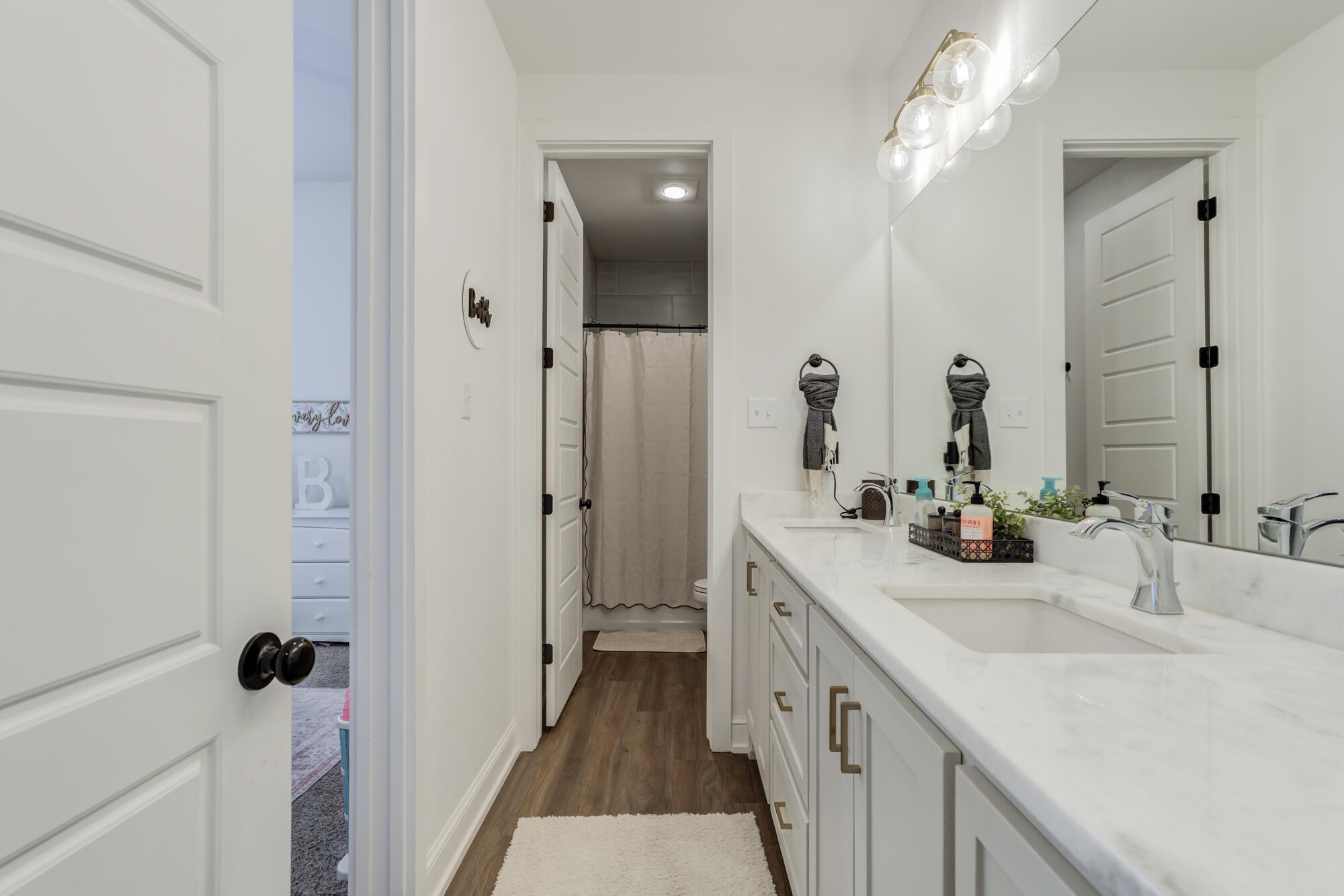 4624 139th Street Lubbock, TX 79424 - Photo 37 of 52 a bathroom with a double vanity sink and a mirror