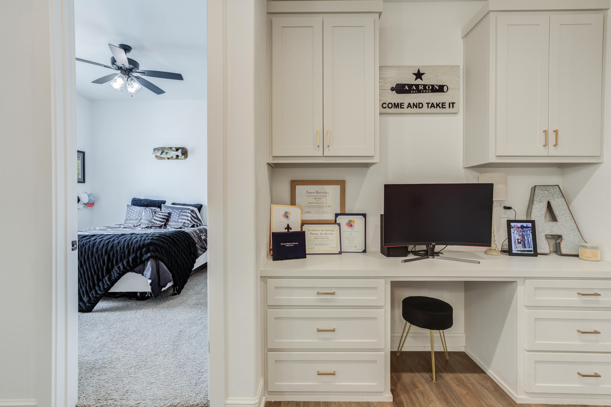 4624 139th Street Lubbock, TX 79424 - Photo 40 of 52 a kitchen with a refrigerator and cabinets