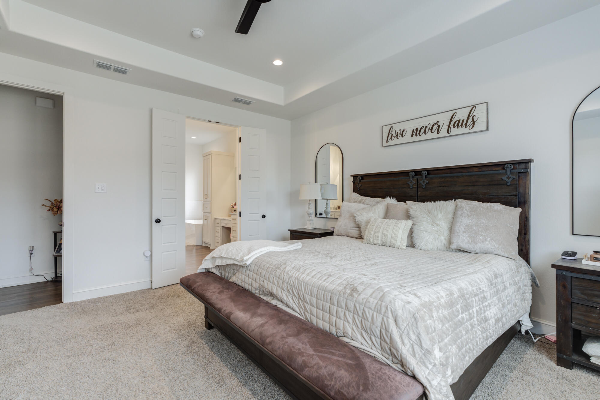 4624 139th Street Lubbock, TX 79424 - Photo 4 of 52 a spacious bedroom with a bed and a view of bathroom