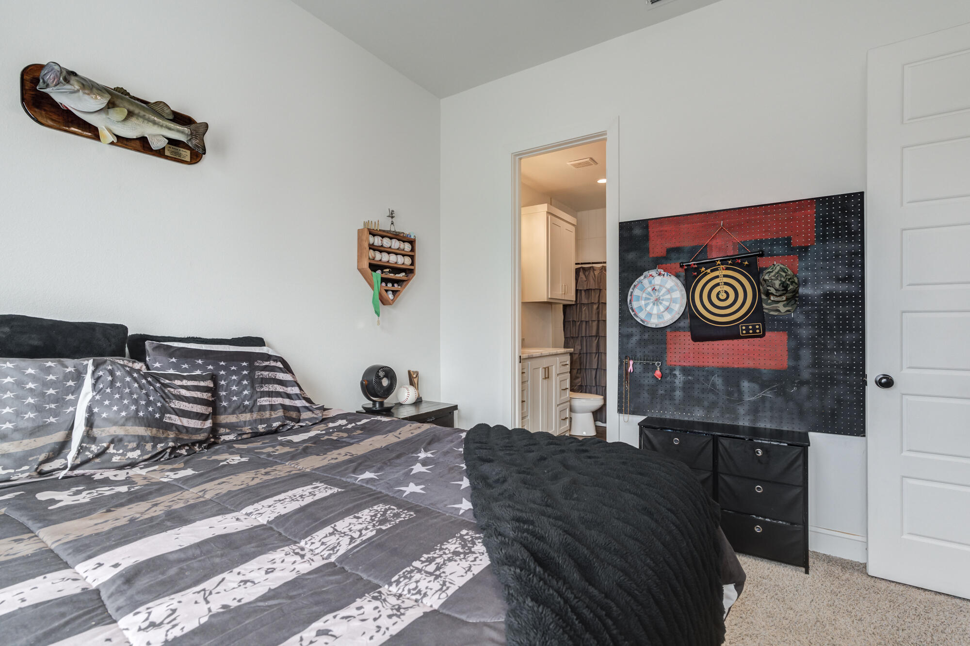 4624 139th Street Lubbock, TX 79424 - Photo 44 of 52 a bedroom with a bed and cabinets