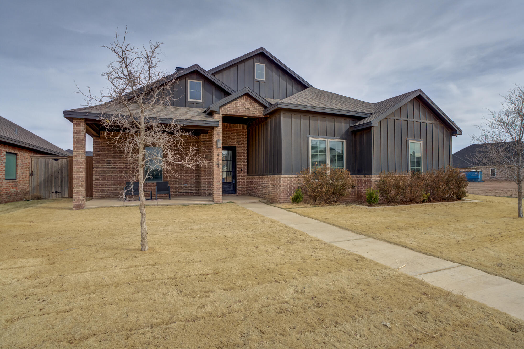 4624 139th Street Lubbock, TX 79424 - Photo 6 of 52 a front view of a house with a yard