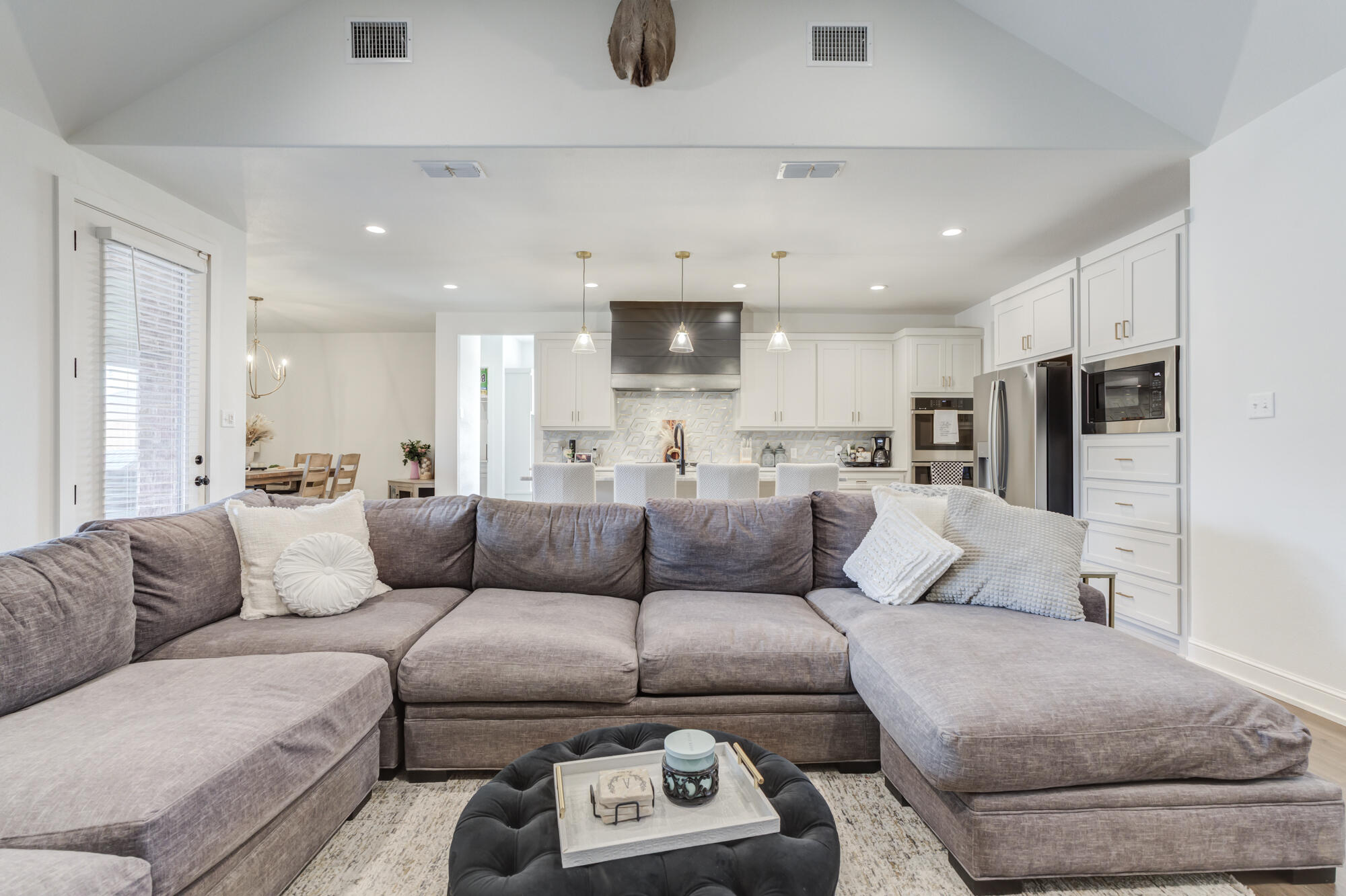 4624 139th Street Lubbock, TX 79424 - Photo 10 of 52 a living room with furniture and a couch