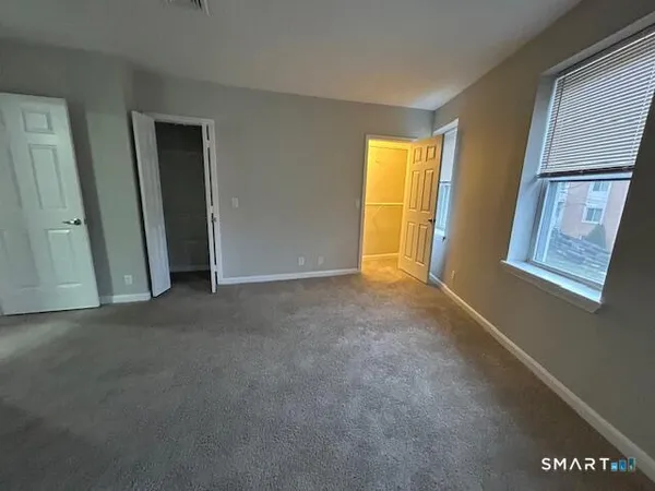 a view of empty room with windows