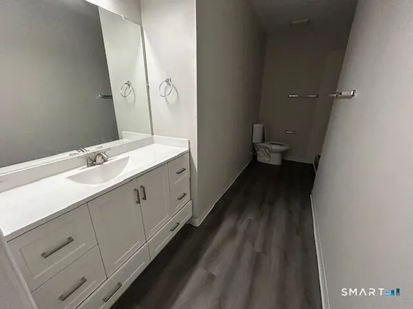 a spacious bathroom with a double vanity sink and a mirror