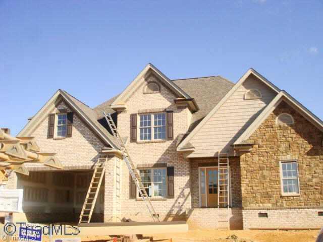 48 The Bluffs Rural Hall, NC 27045 - Photo 1 of 9 Exterior Front. Brick and stone are being set in place. Call to meet with the Builder to discuss he finishing touches.