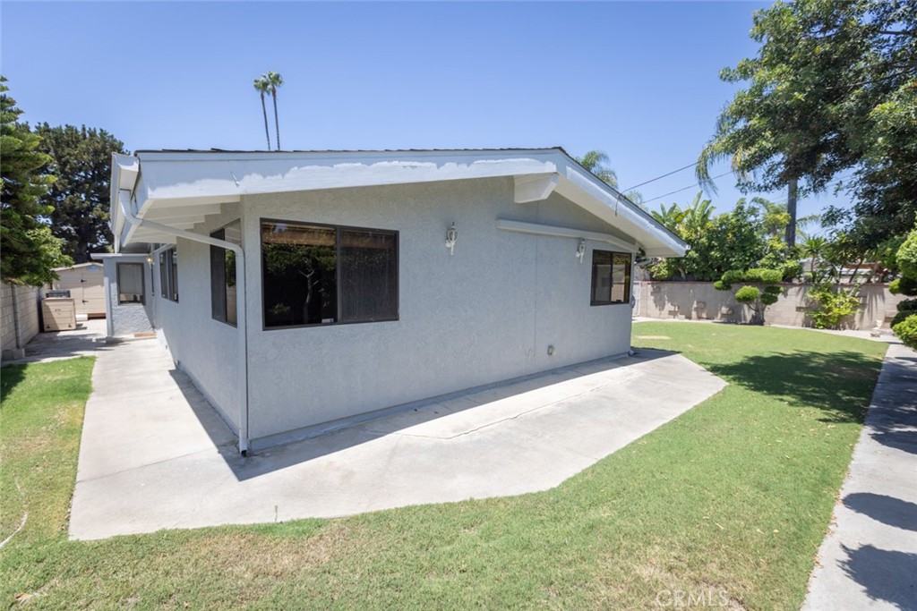 14732 Candeda Place Tustin, CA 92780 - Photo 8 of 37 a front view of a house with a yard