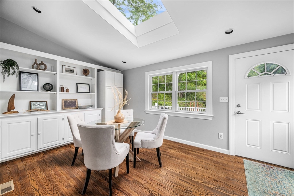 8 Baker Avenue Beverly, MA 01915 - Photo 3 of 40 a view of a dining room with furniture windows and wooden floor