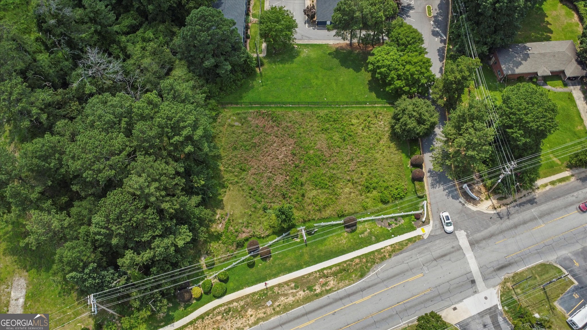 a view of a yard with a lake view