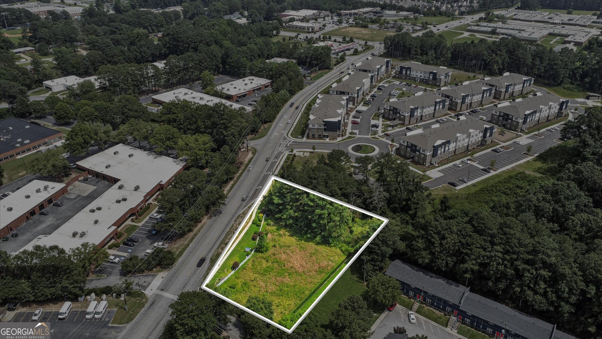 0 West Fayetteville Road Atlanta, GA 30349 - Photo 15 of 18 an aerial view of multiple houses with a yard