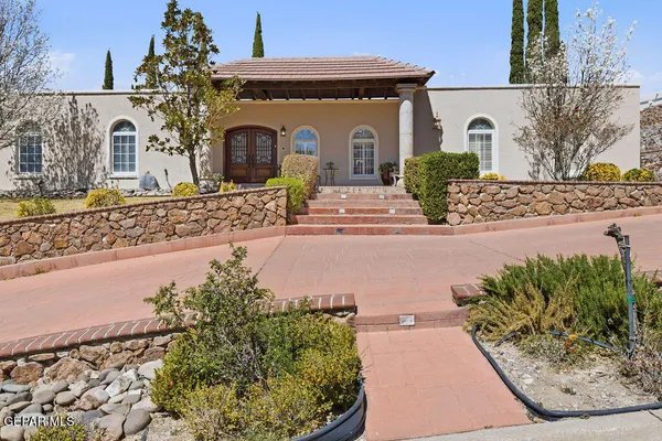 a house view with a sitting space and garden space