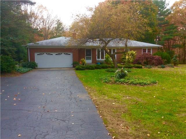 275 Teller Road Monroe, CT 06468 - Photo 1 of 1 a front view of a house with yard and green space