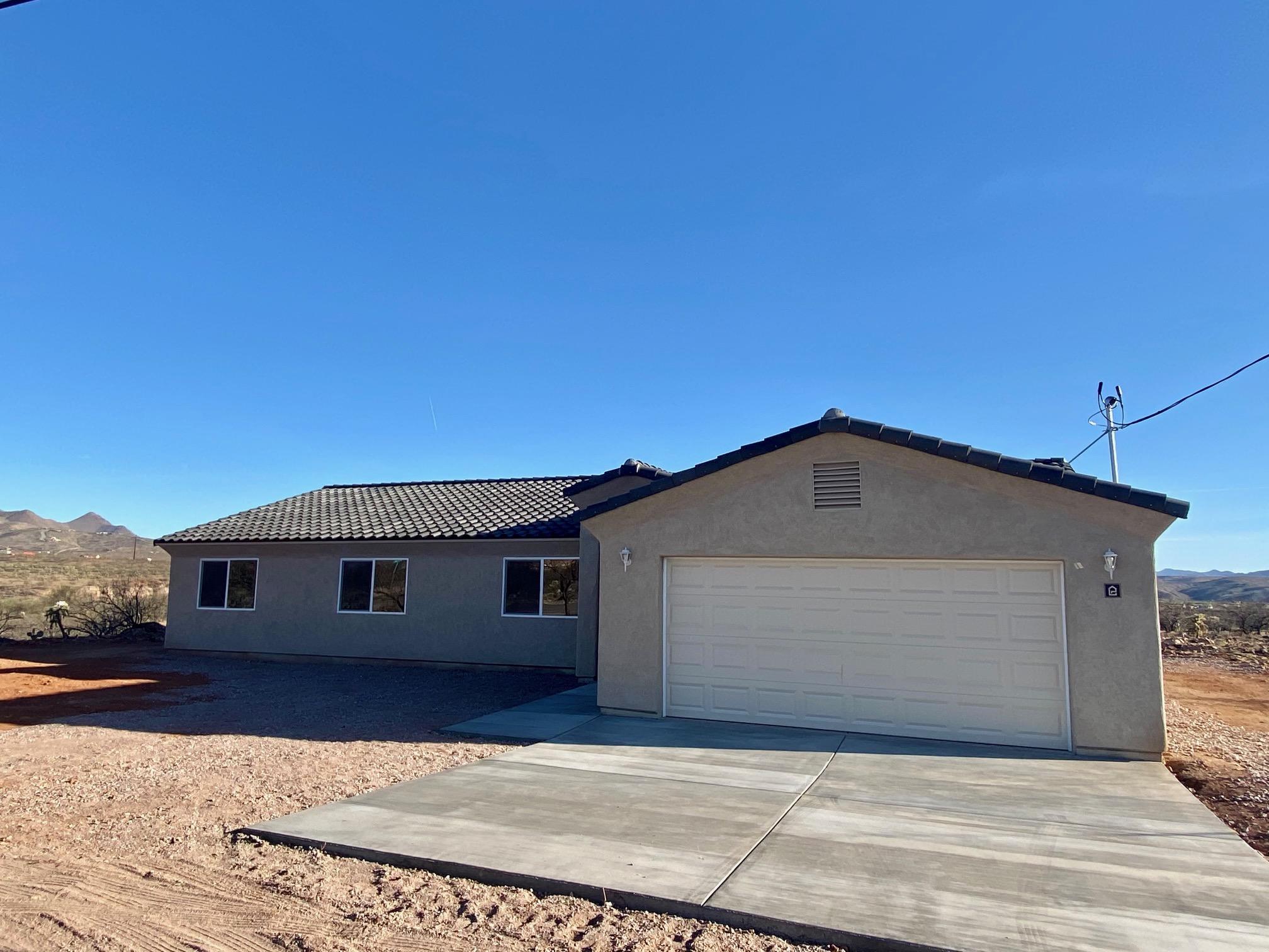 77 Ver Patria Rio Rico, AZ 85648 - Photo 3 of 50 a front view of a house with a yard