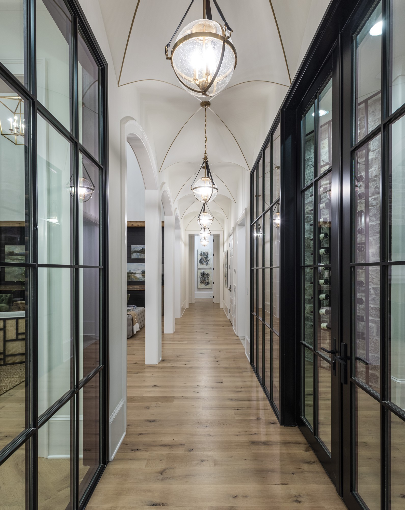 1561 Sunset Road Brentwood, TN 37027 - Photo 17 of 56 a view of a hallway with wooden floor windows and a chandelier