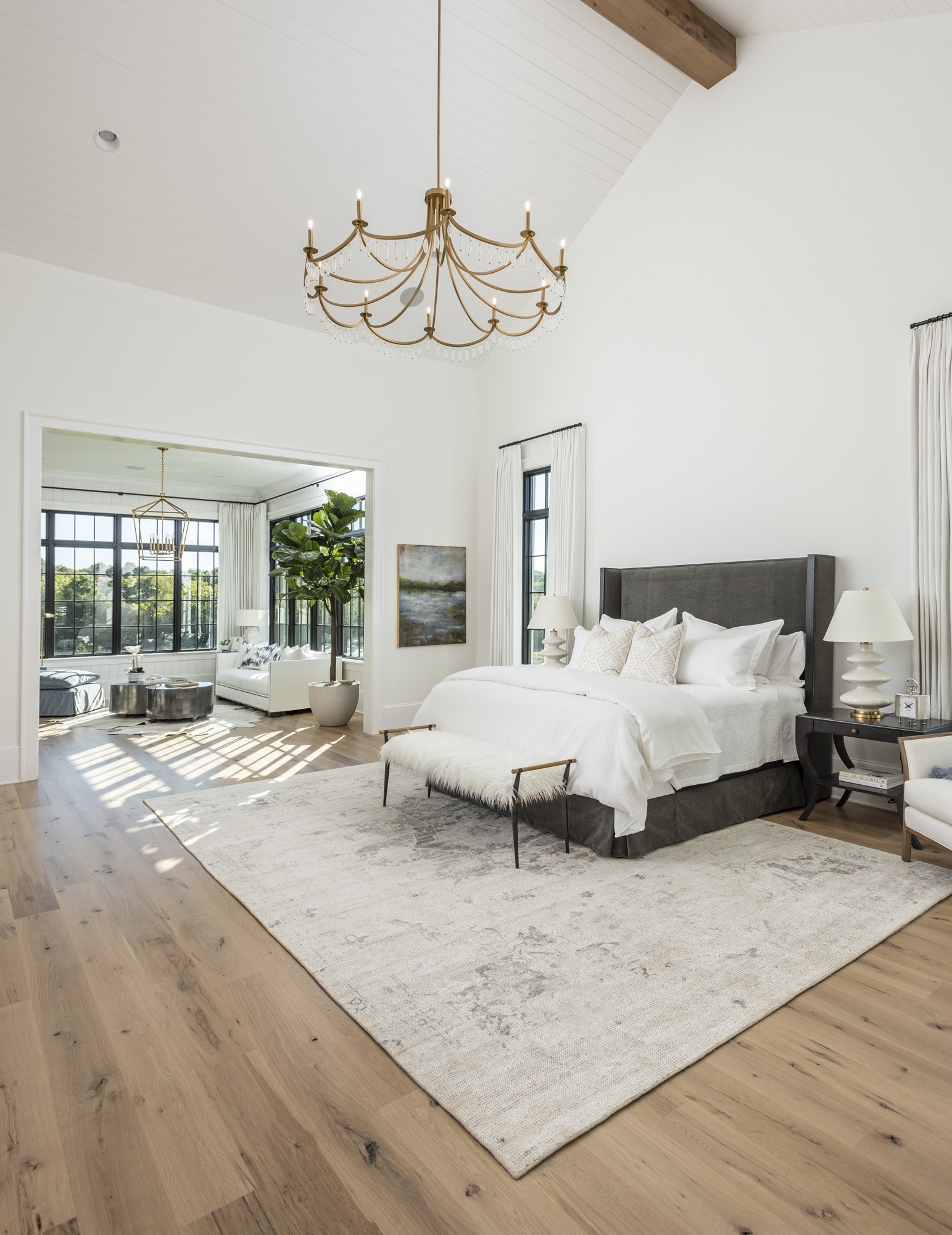 1561 Sunset Road Brentwood, TN 37027 - Photo 18 of 56 a bedroom with a bed a chandelier and glass door