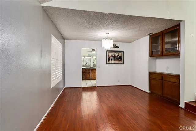 a kitchen with stainless steel appliances granite countertop a sink a stove and cabinets