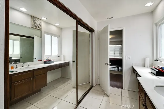 a view of house with yard and sitting area