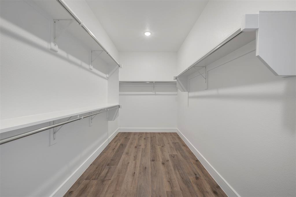 1004 Ashcroft Lane Justin, TX 76247 - Photo 15 of 39 a view of a hallway with wooden floor